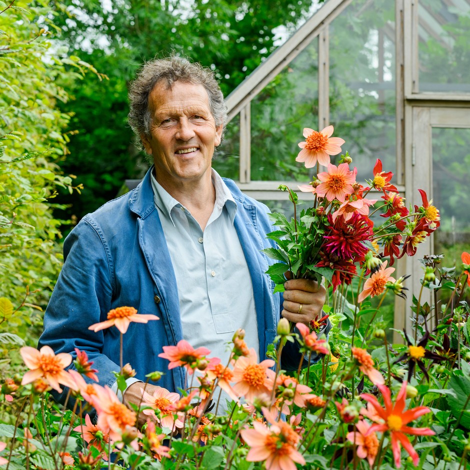 Monty Don holding dahlias.