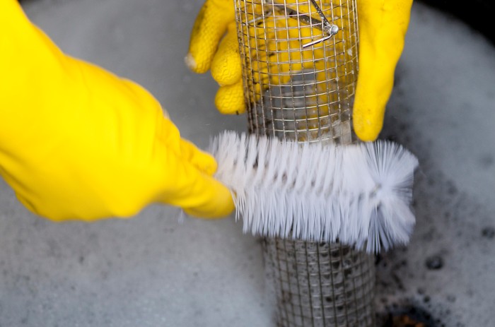 Cleaning a bird feeder Cleaning a bird feeder