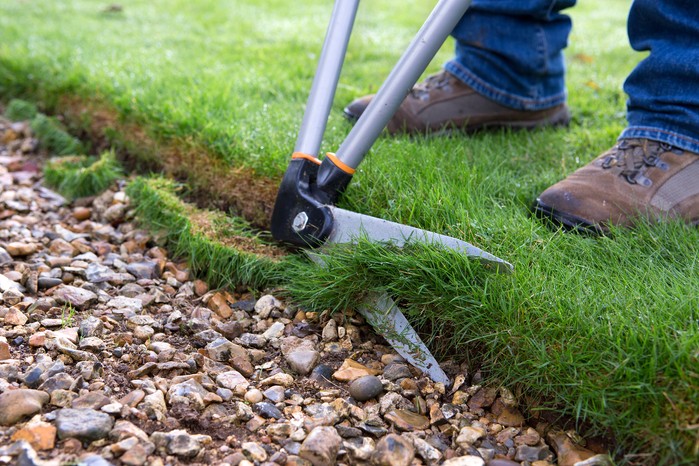 Edging a lawn with lawn shears Edging a lawn with lawn shears